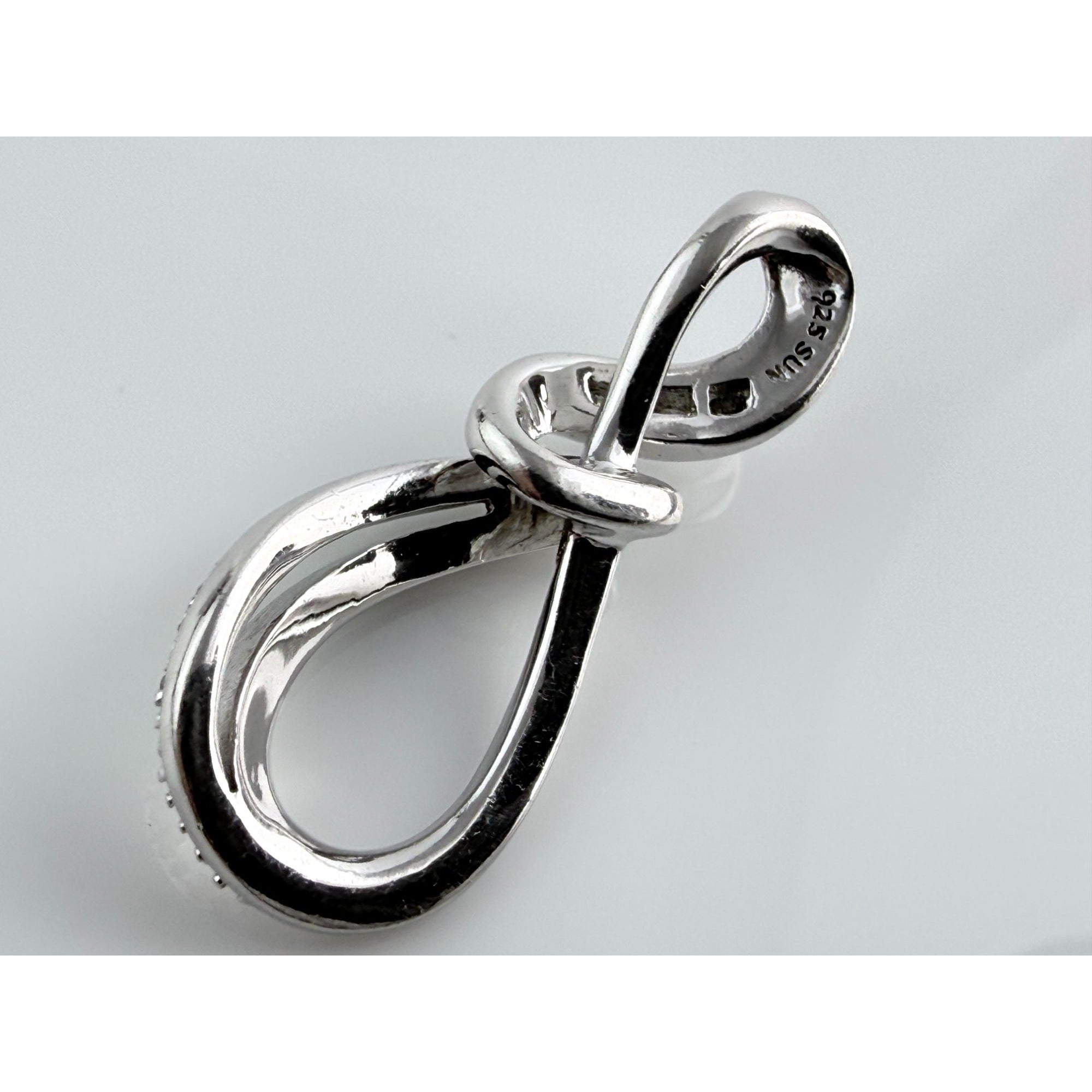 SUN Designer Sterling Silver Natural Melee Diamond Studded Loop Knot Pendant 2g