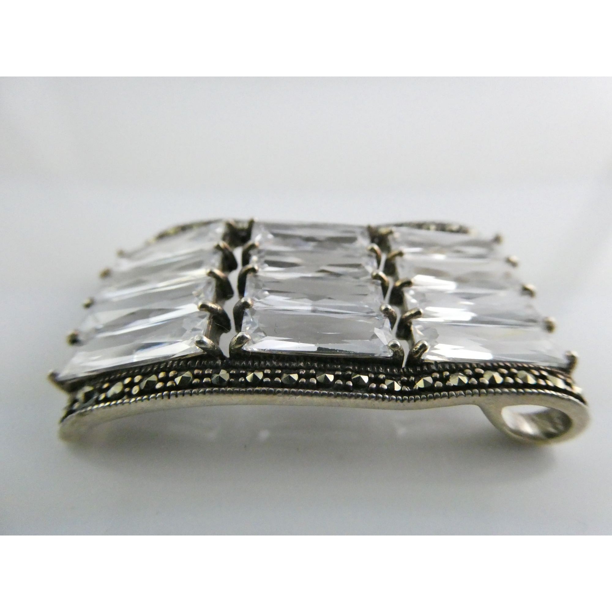 Sterling Silver Twelve White Crystal and Marcasite Lined Rectangular Pendant 925