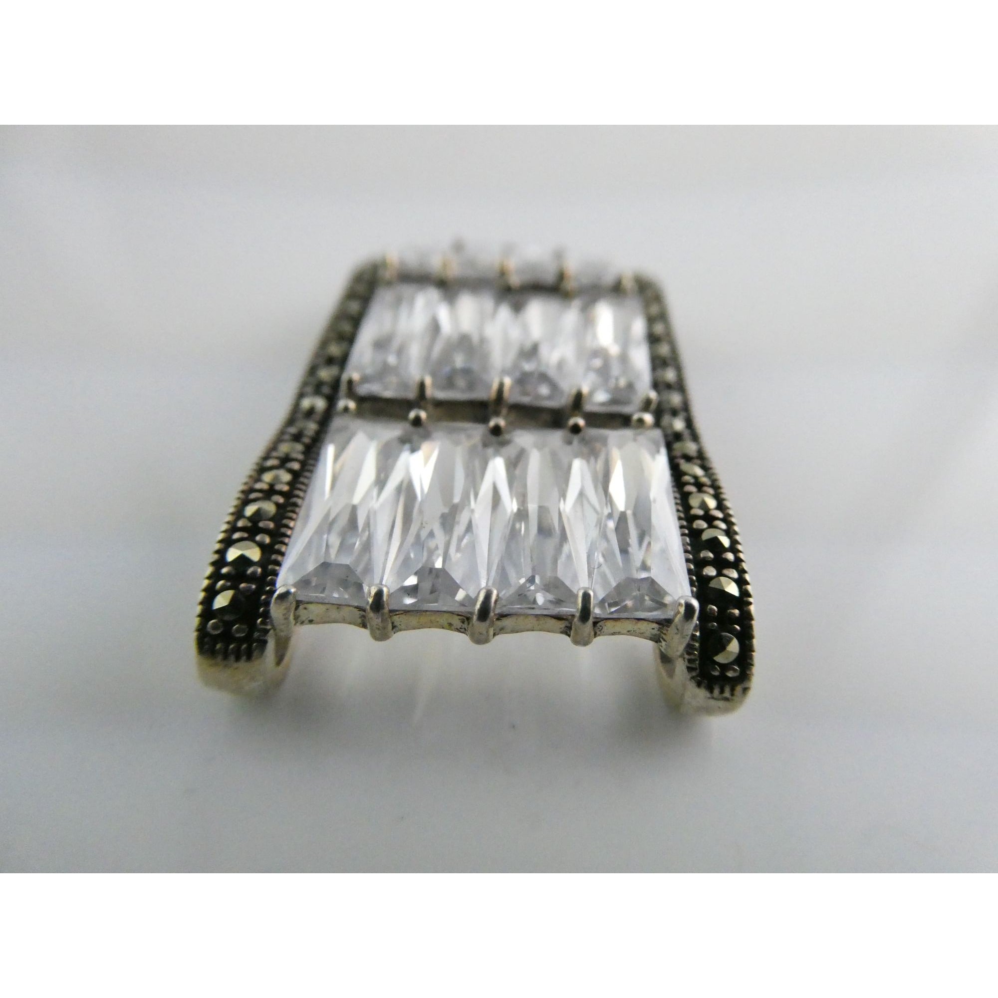 Sterling Silver Twelve White Crystal and Marcasite Lined Rectangular Pendant 925