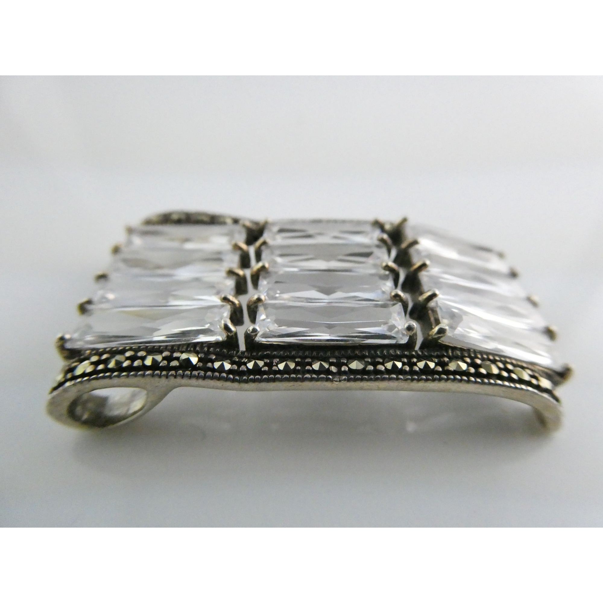 Sterling Silver Twelve White Crystal and Marcasite Lined Rectangular Pendant 925