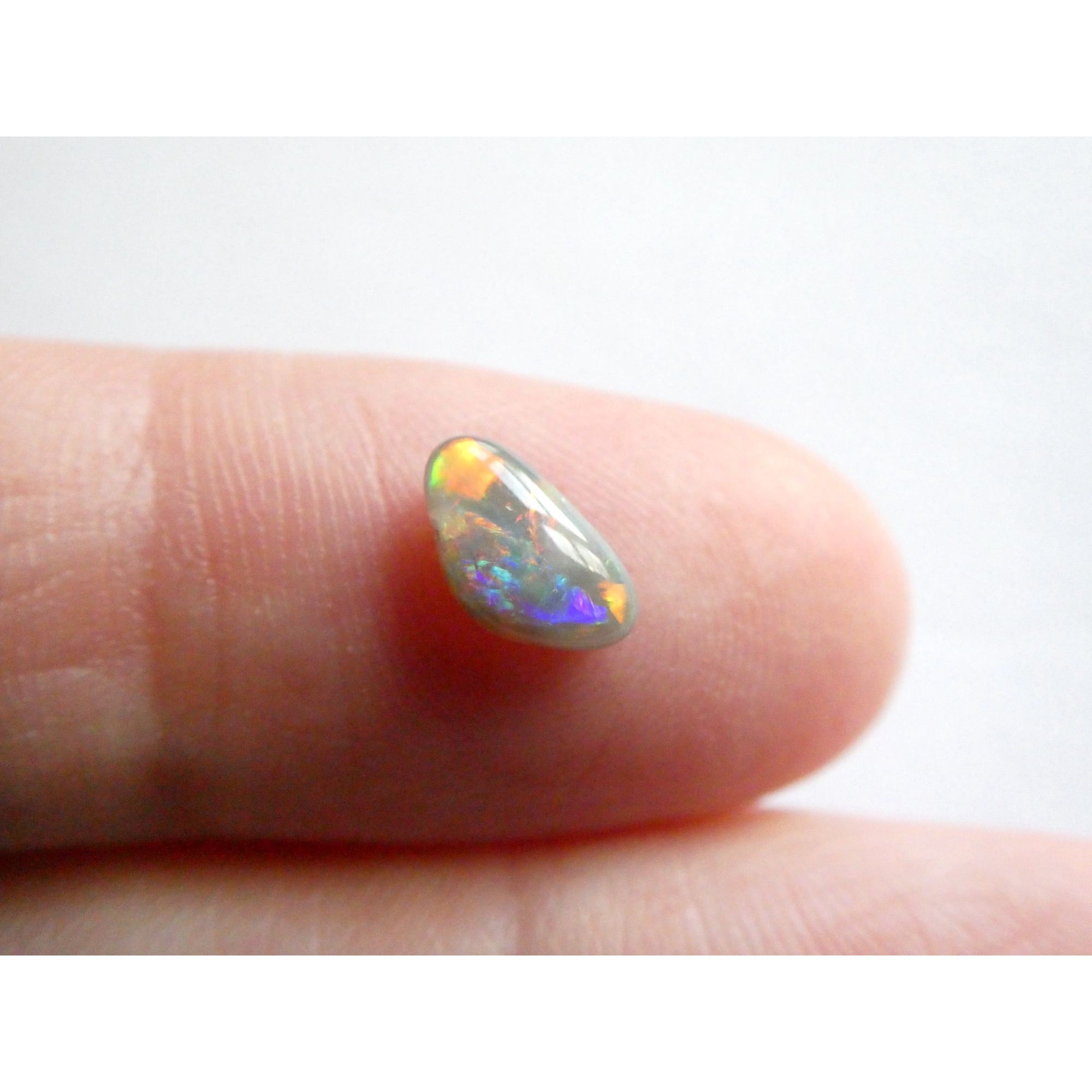 Australian Polished and Cut Freeform Opal Cabochon .60 CT Weight 8.32mm x 4.66mm