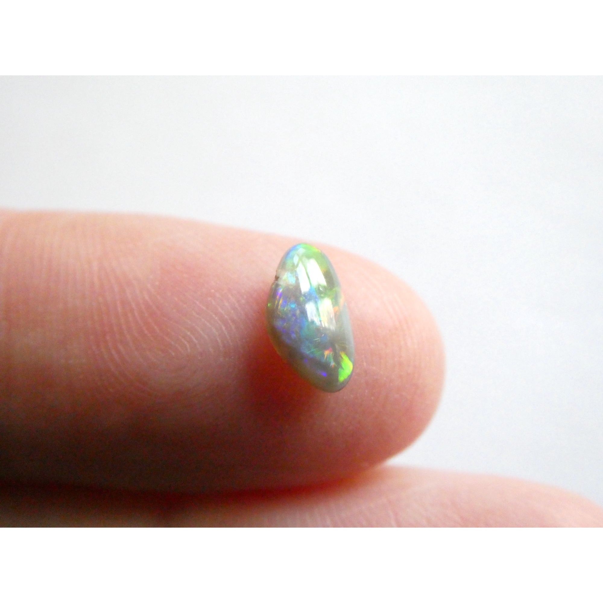 Australian Polished and Cut Freeform Opal Cabochon .60 CT Weight 8.32mm x 4.66mm