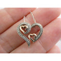 CO Sterling Silver and 10k Gold Natural Diamond Three Hearts Pendant Necklace