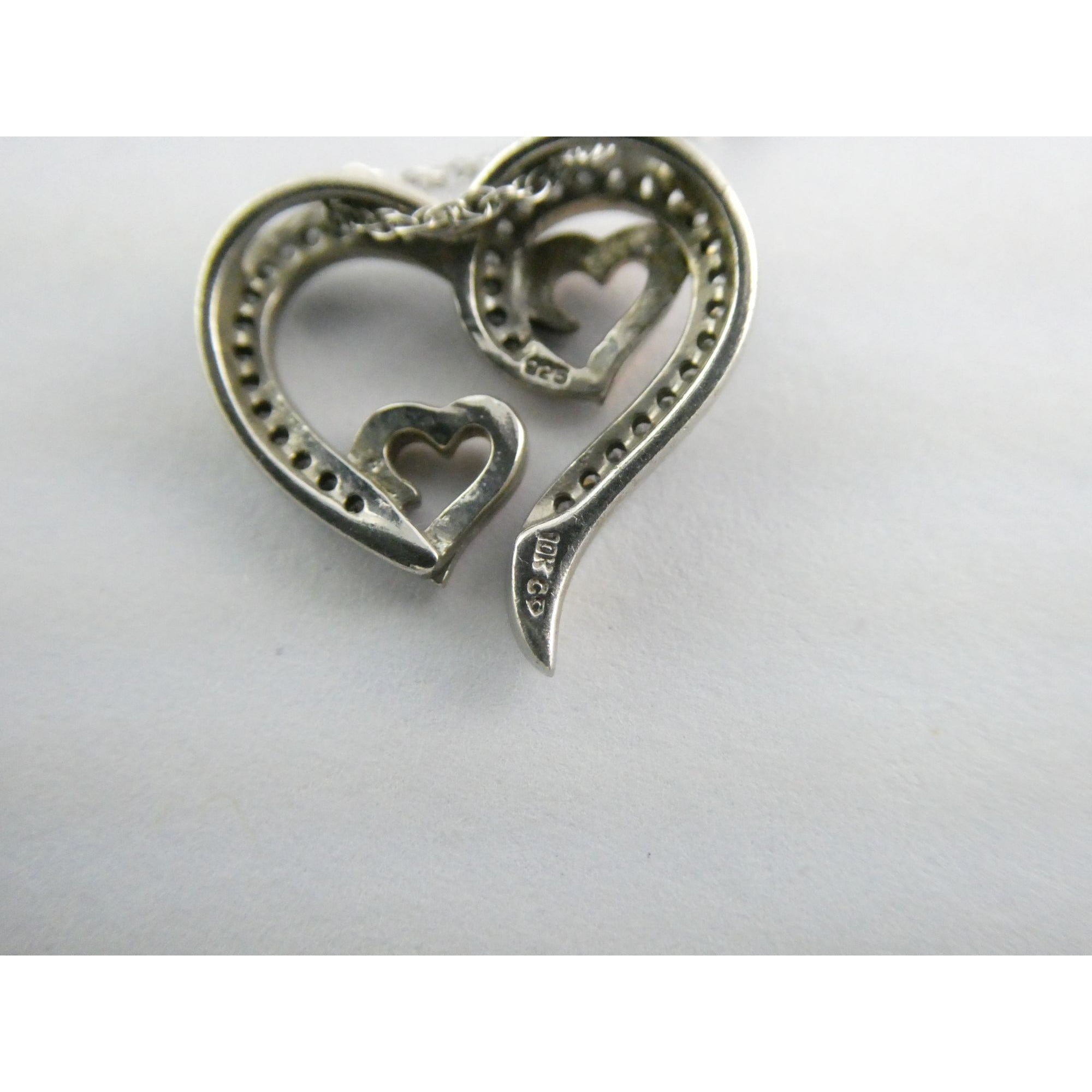 CO Sterling Silver and 10k Gold Natural Diamond Three Hearts Pendant Necklace