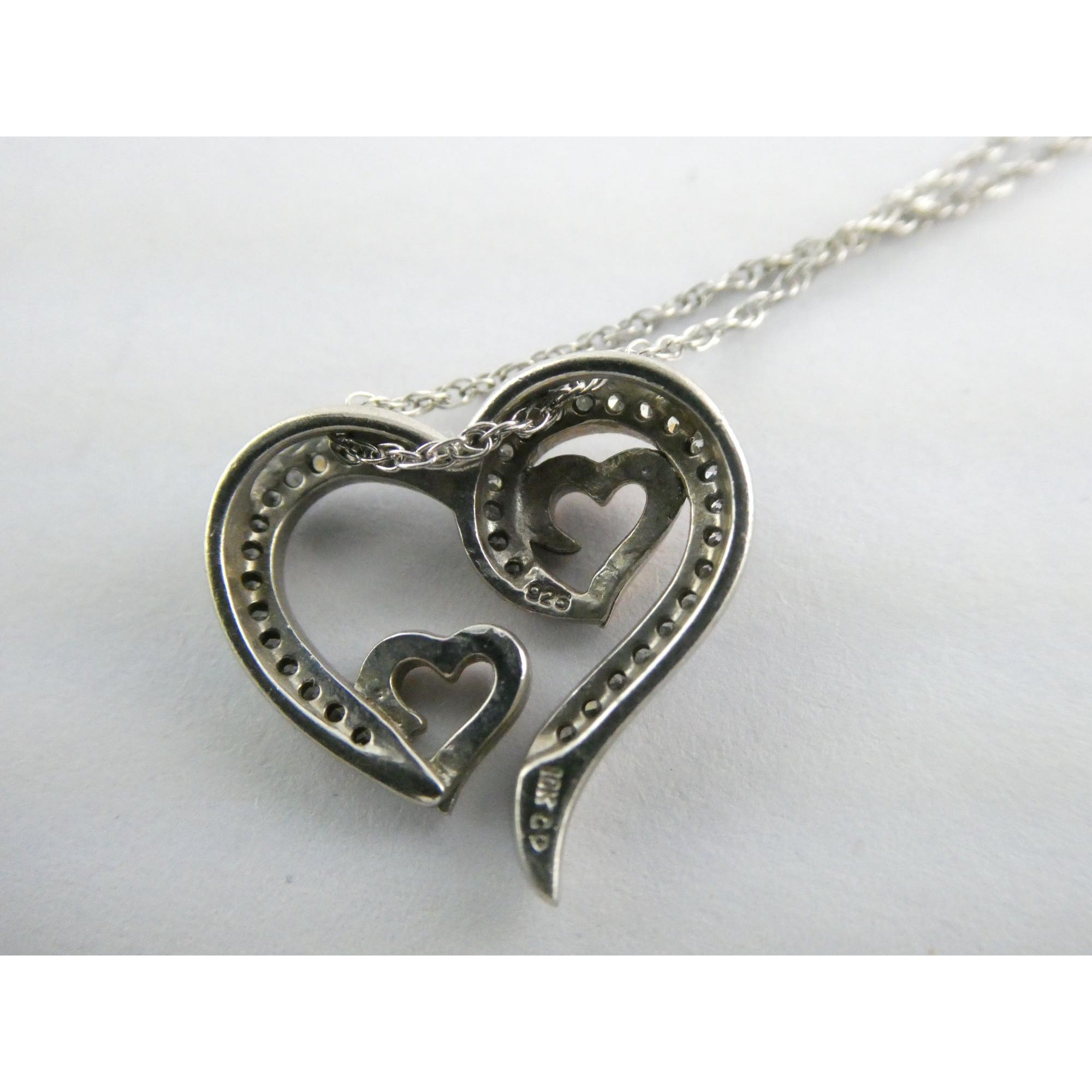 CO Sterling Silver and 10k Gold Natural Diamond Three Hearts Pendant Necklace