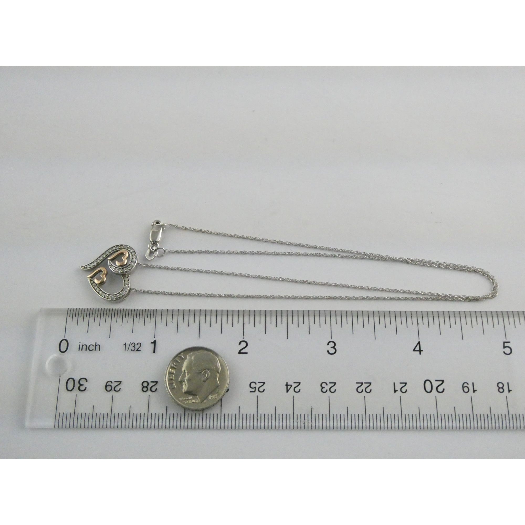CO Sterling Silver and 10k Gold Natural Diamond Three Hearts Pendant Necklace