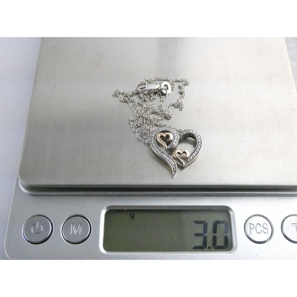 CO Sterling Silver and 10k Gold Natural Diamond Three Hearts Pendant Necklace