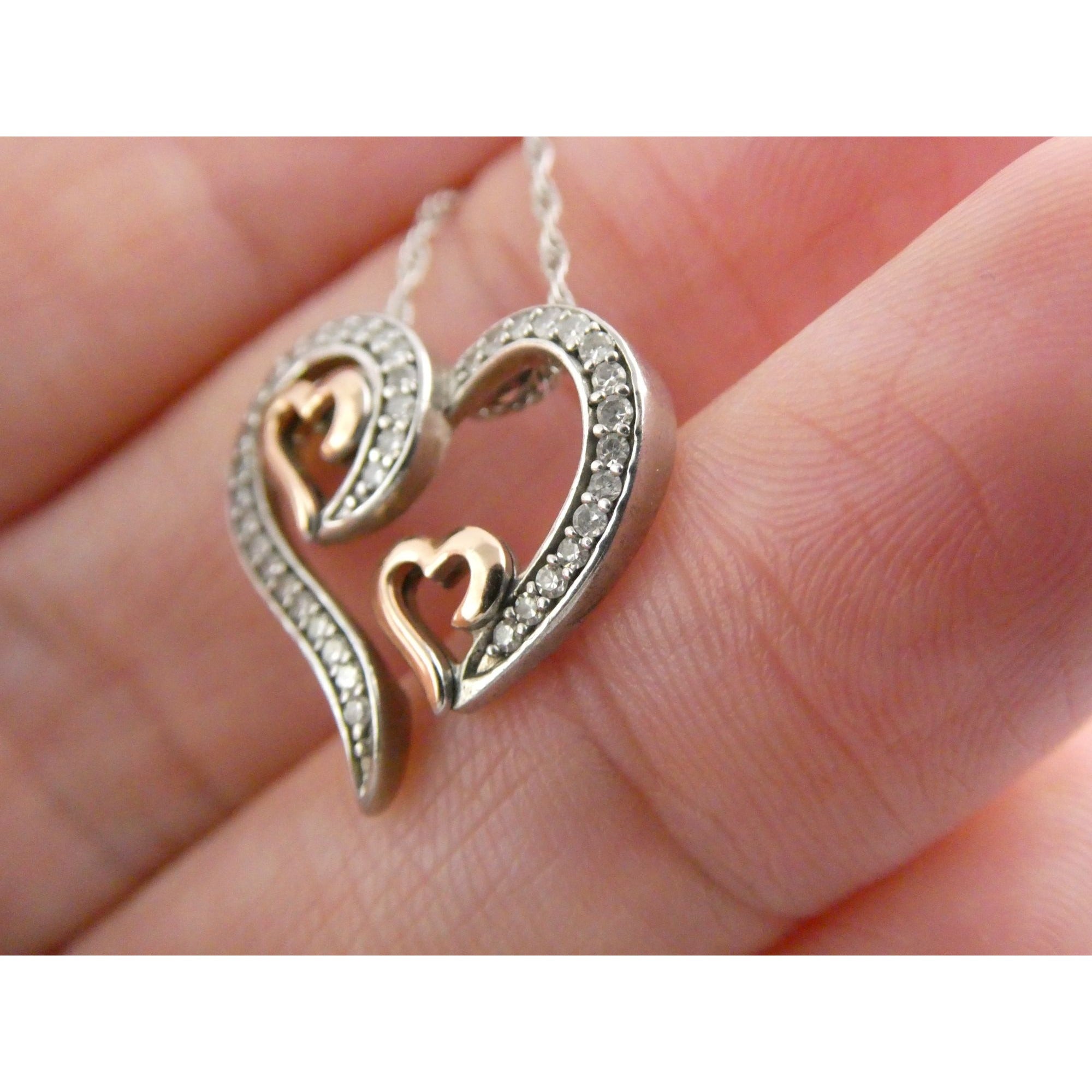 CO Sterling Silver and 10k Gold Natural Diamond Three Hearts Pendant Necklace