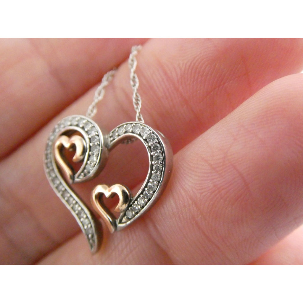 CO Sterling Silver and 10k Gold Natural Diamond Three Hearts Pendant Necklace