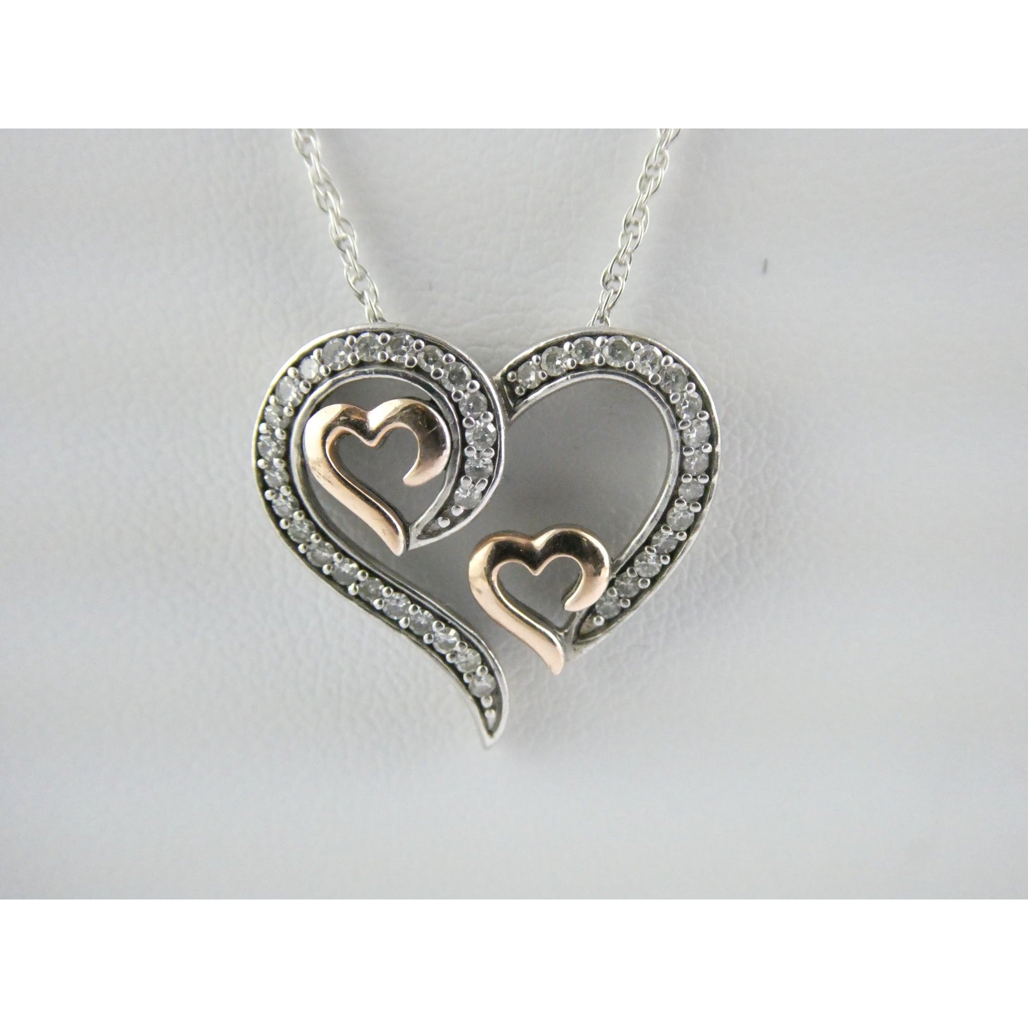 CO Sterling Silver and 10k Gold Natural Diamond Three Hearts Pendant Necklace