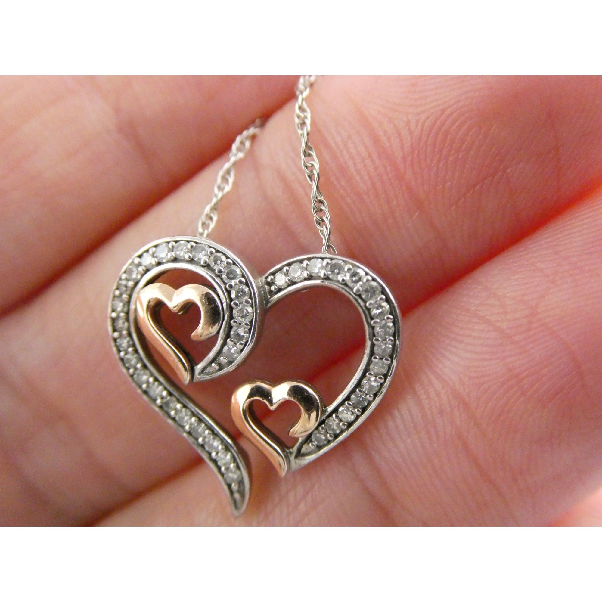 CO Sterling Silver and 10k Gold Natural Diamond Three Hearts Pendant Necklace