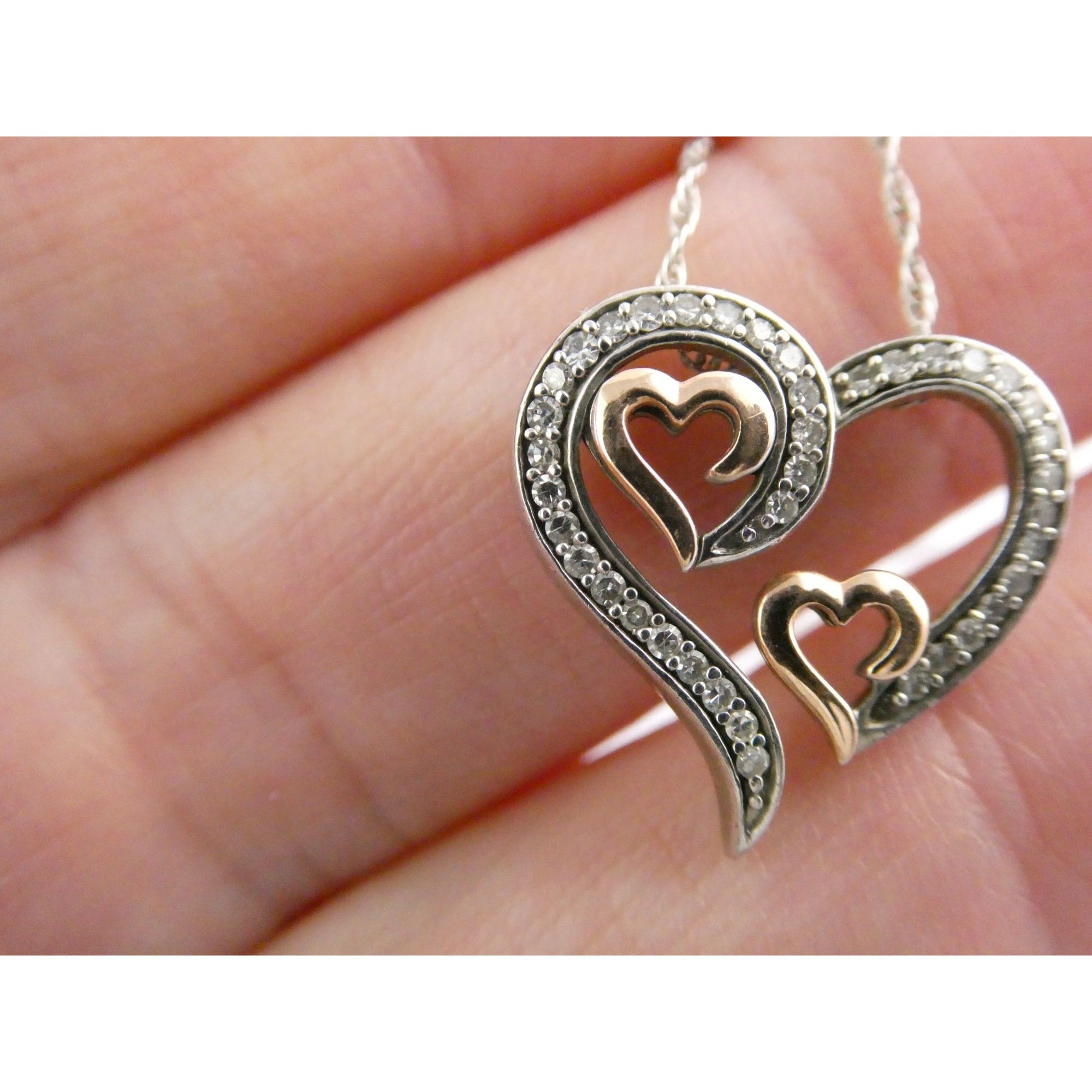 CO Sterling Silver and 10k Gold Natural Diamond Three Hearts Pendant Necklace