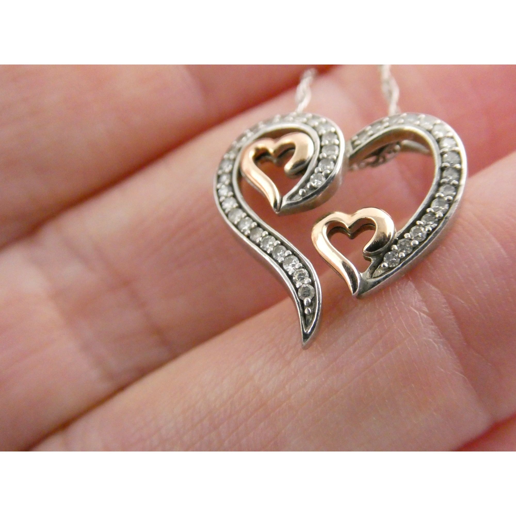 CO Sterling Silver and 10k Gold Natural Diamond Three Hearts Pendant Necklace
