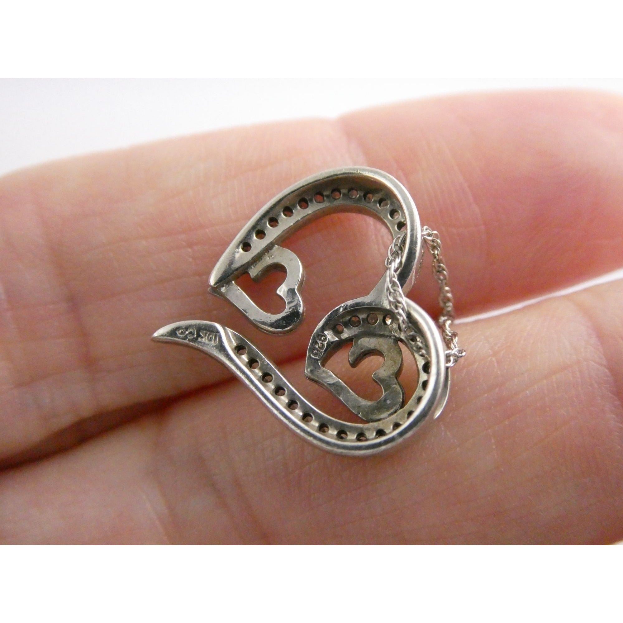 CO Sterling Silver and 10k Gold Natural Diamond Three Hearts Pendant Necklace
