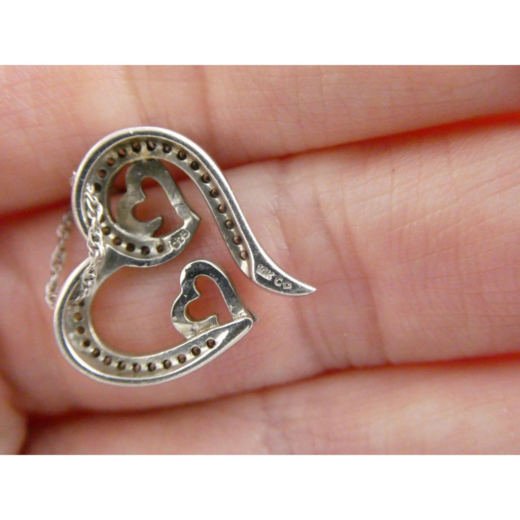 CO Sterling Silver and 10k Gold Natural Diamond Three Hearts Pendant Necklace