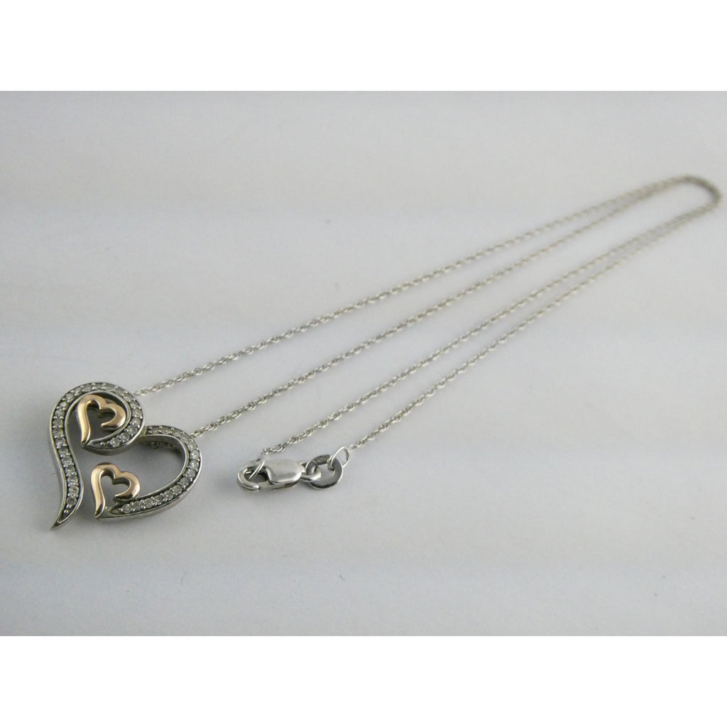 CO Sterling Silver and 10k Gold Natural Diamond Three Hearts Pendant Necklace