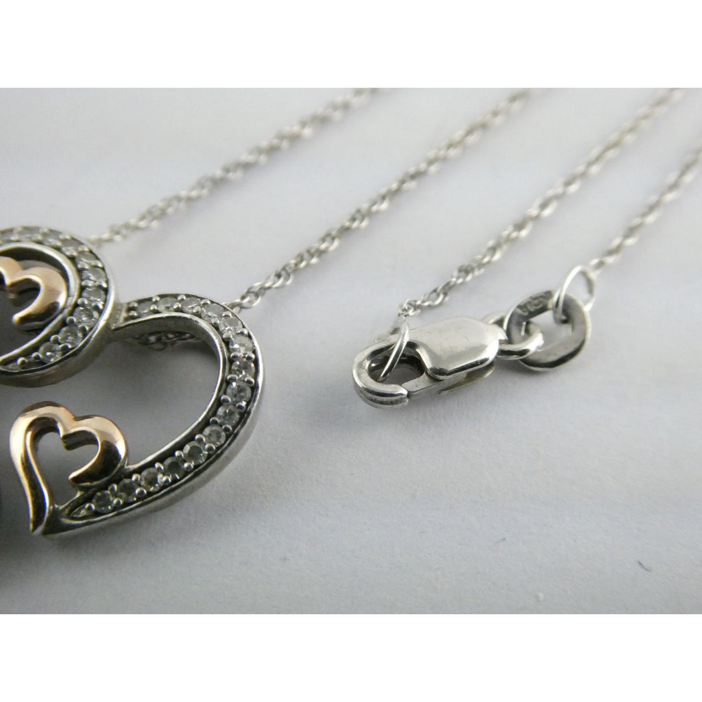 CO Sterling Silver and 10k Gold Natural Diamond Three Hearts Pendant Necklace
