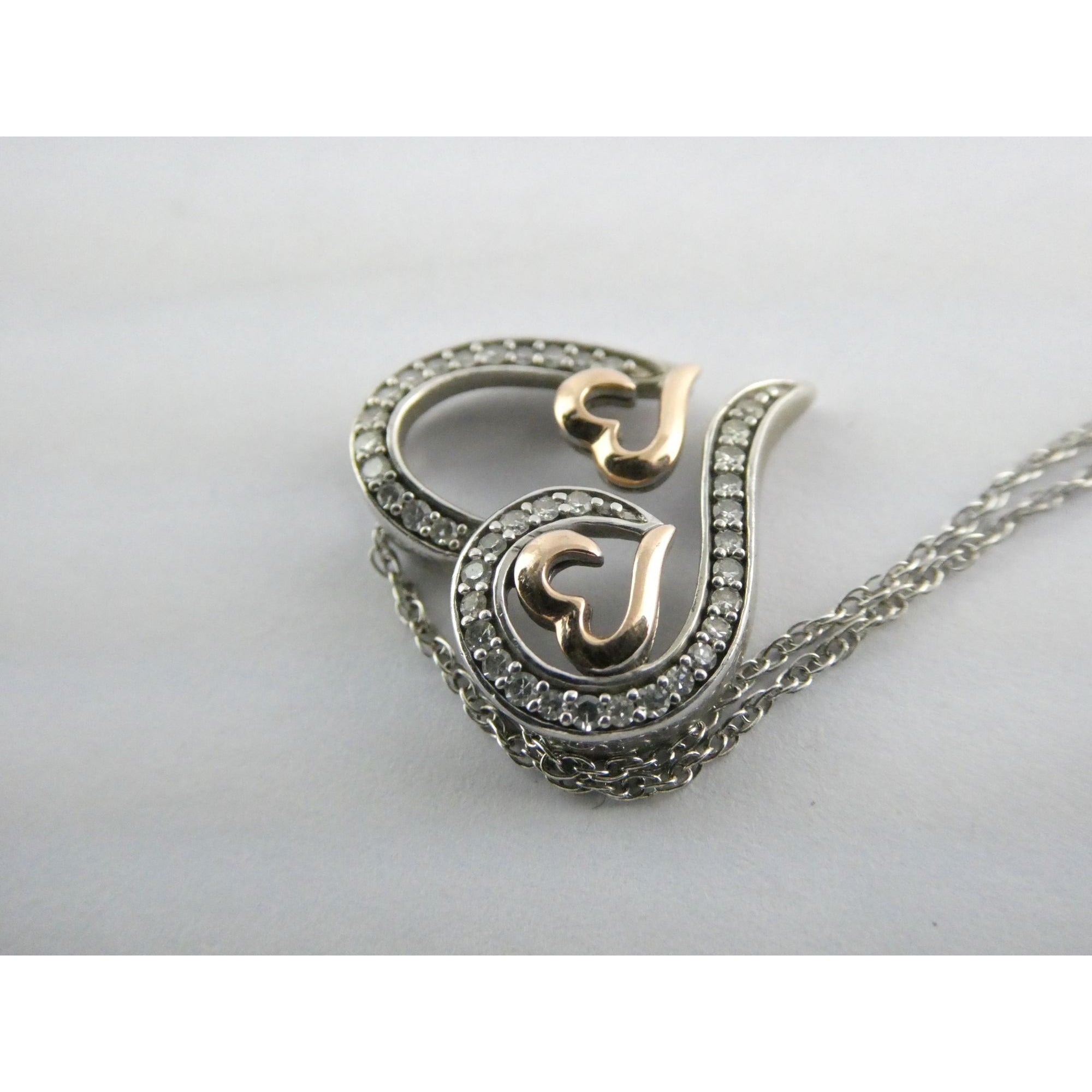 CO Sterling Silver and 10k Gold Natural Diamond Three Hearts Pendant Necklace