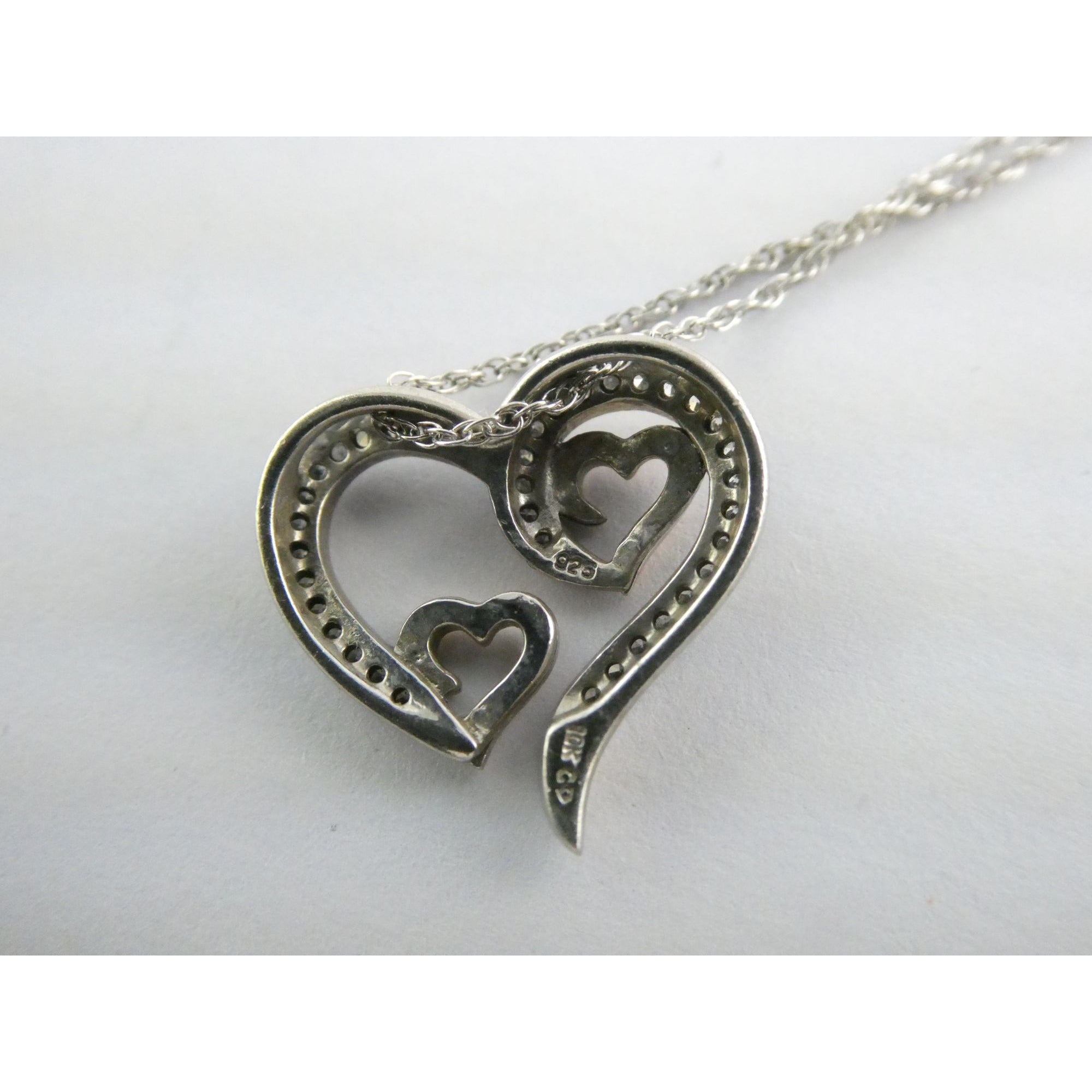 CO Sterling Silver and 10k Gold Natural Diamond Three Hearts Pendant Necklace